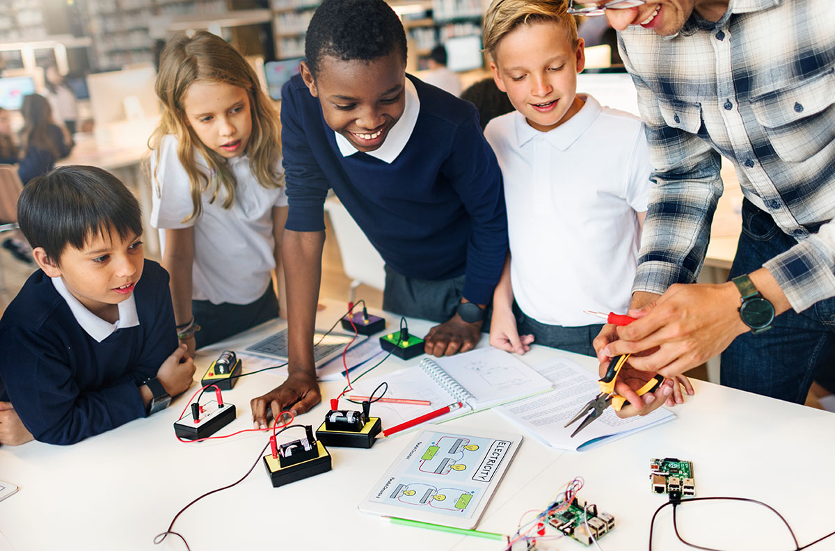 A group of children learning about electricity